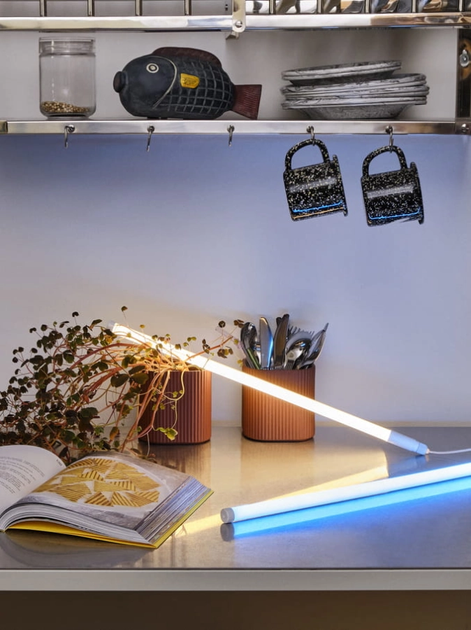 Neon Tube Slim 50 blue_Neon Tube Slim 50 warm white_Facade Herb Pot S dark terracotta_ Enamel Mug Sprinkle black.jpg