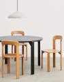 Rey Table vulcano laminate deep black wb lacquer beech_Rey Chair golden wb lacquer beech_Pao Steel Pendant 230 cream white.jpg