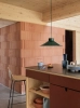 19418-en-top-pendant-36-dark-green-fiber-counter-stool-65-ochre-black-tube-raise-carafe-platform-tray-muuto-org.webp