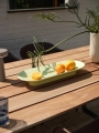 26100-en-mere-bowl-light-green-70-70-outdoor-table-sapele-mahogany-fiber-outdoor-armchair-brown-green-ease-taupe-kink-muuto-org.webp