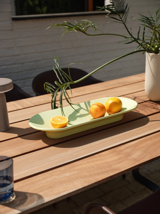 26100-en-mere-bowl-light-green-70-70-outdoor-table-sapele-mahogany-fiber-outdoor-armchair-brown-green-ease-taupe-kink-muuto-org.webp
