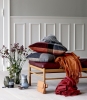 Throws and cushions in terracotta and red magma.jpg