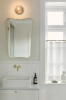 nuura-liila-1-small-wall-lamp-dark-bronze-ip44-bathroom.jpg.webp