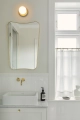 nuura-liila-1-small-bathroom-wall-lamp-nordic-gold-opal-ip44.jpg.webp