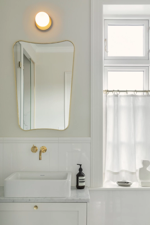 nuura-liila-1-small-bathroom-wall-lamp-nordic-gold-opal-ip44.jpg.webp