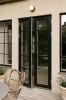 nuura-liila-1-outdoor-entrance-door-lighting-dark-bronze-aw22.jpg.webp