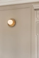 nuura-liila-muuse-small-gold-wall-lamp-closeup.jpg.webp