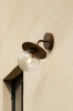nuura-liila-wall-outdoor-functional-wall-light-dark-bronze-optic-clear-aw22.jpg.webp