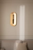 nuura-rick-tegelaar-sasi-large-brass-wall-lamp-closeup.jpg.webp