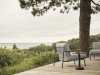 Settle-sofa-2-seater-lounge-chair-ribbed-weave-2-dark-green-linear-steel-coffee-table-dark-green-muuto-org_3.jpg