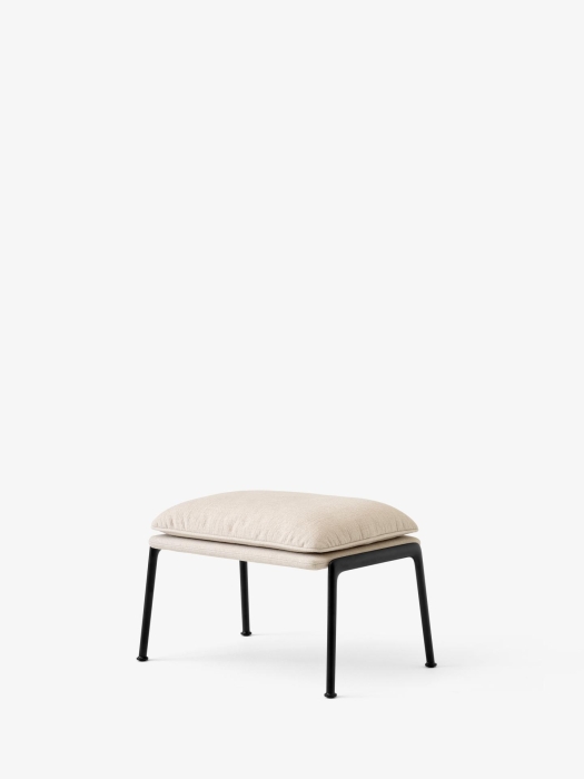Muno Footstool LN20_Warm Black Legs w. Cifrado 0221_Angled Front.jpg