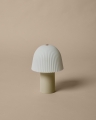 FermLiving_SS25_PackshotsWithBackground_FrillPortableLamp_CashmereWhite_1104271028.jpg