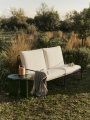 FermLiving_SS25_Desert2-Seater_PureBoucle_Black_Off-white_1104270930_DeyaSideTable_47_DarkGreen_1104270815_LuverPortableLamp_Natural_1104271033_PilaLinenThrow_BlackElmGreen_1104270970.jpg
