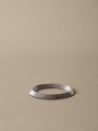 FermLiving_SS25_PackshotsWithBackground_LeveeTrivet_Aluminium_1104270874.jpg