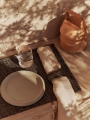 FermLiving_SS25_ErenaSidePlate_22_Cream_1104270742_GatherNapkinRings_SetOf2_BlackNatural_1104270861_GatherPlacemats_SetOf4_BlackNatural_1104270859_DimpleGlasses_SetOf2_Clear_1104270155_LuverPortabl.jpg