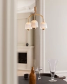 Nuura_Asteea_3_Satin_brass_-_rippled_clear_lifestyle_3.jpg.webp