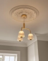 Nuura_Asteea_3_Satin_brass_-_rippled_clear_lifestyle_5.jpg.webp