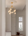 Nuura_Asteea_9_Satin_brass_-_rippled_clear_lifestyle_5.jpg.webp
