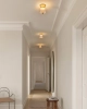 Nuura_Asteea_Ceiling_Satin_brass_-_rippled_clear_lifestyle.jpg.webp