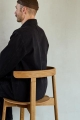 Form and Refine_Lunar-chair-Oak-wooden-seat_man-seating.jpg